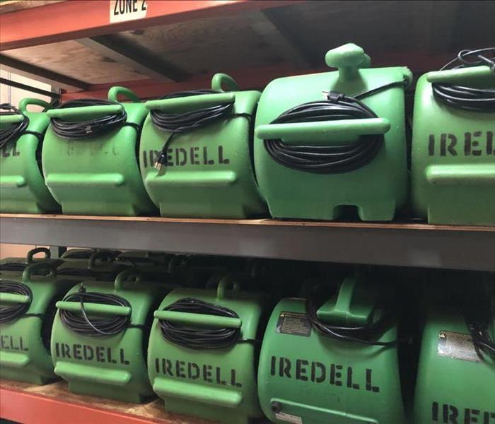 Rows of green air movers with "Iredell" written on them