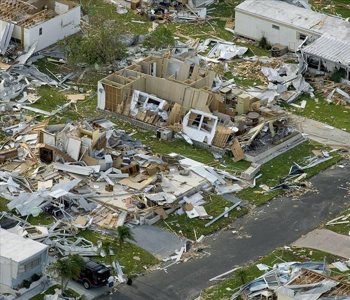 Debris and damaged homes after a hurricane passed through