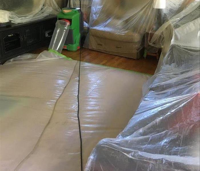 Floors and furniture covered with plastic