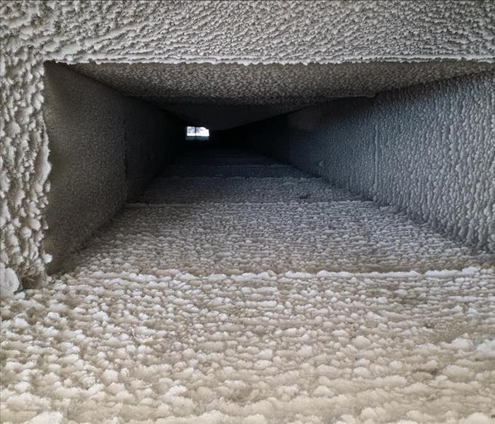Dirt-covered interior of an HVAC system